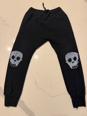 nununu Black Joggers with Gray Skull Knee Patches